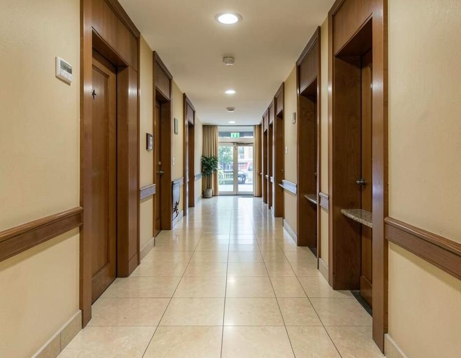 Apartment building corridor with beige porcelain floor tiles